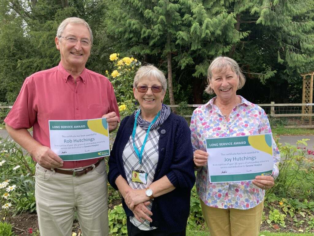 Rob and Joy Hutchins with certificates presented by Jeanette Whitford chair of board.