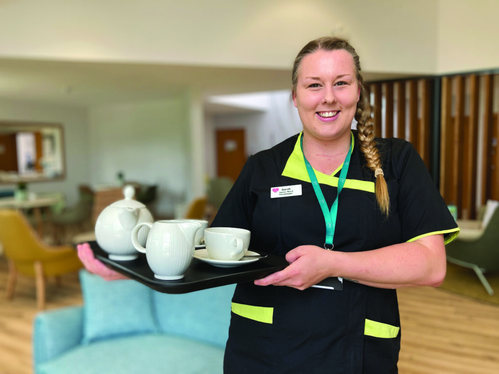 Sarah, Housekeeper with tea tray