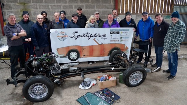 Members of the Triumph Sports Six Club Shropshire Area Group with Karen Miller (centre) and the Triumph Spitfire