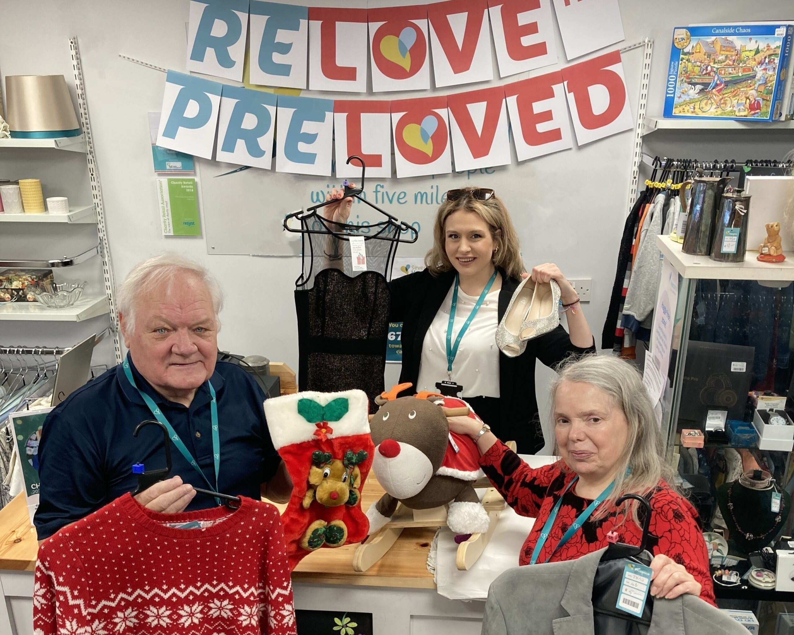 Staff and volunteers with Christmas gifts and clothes