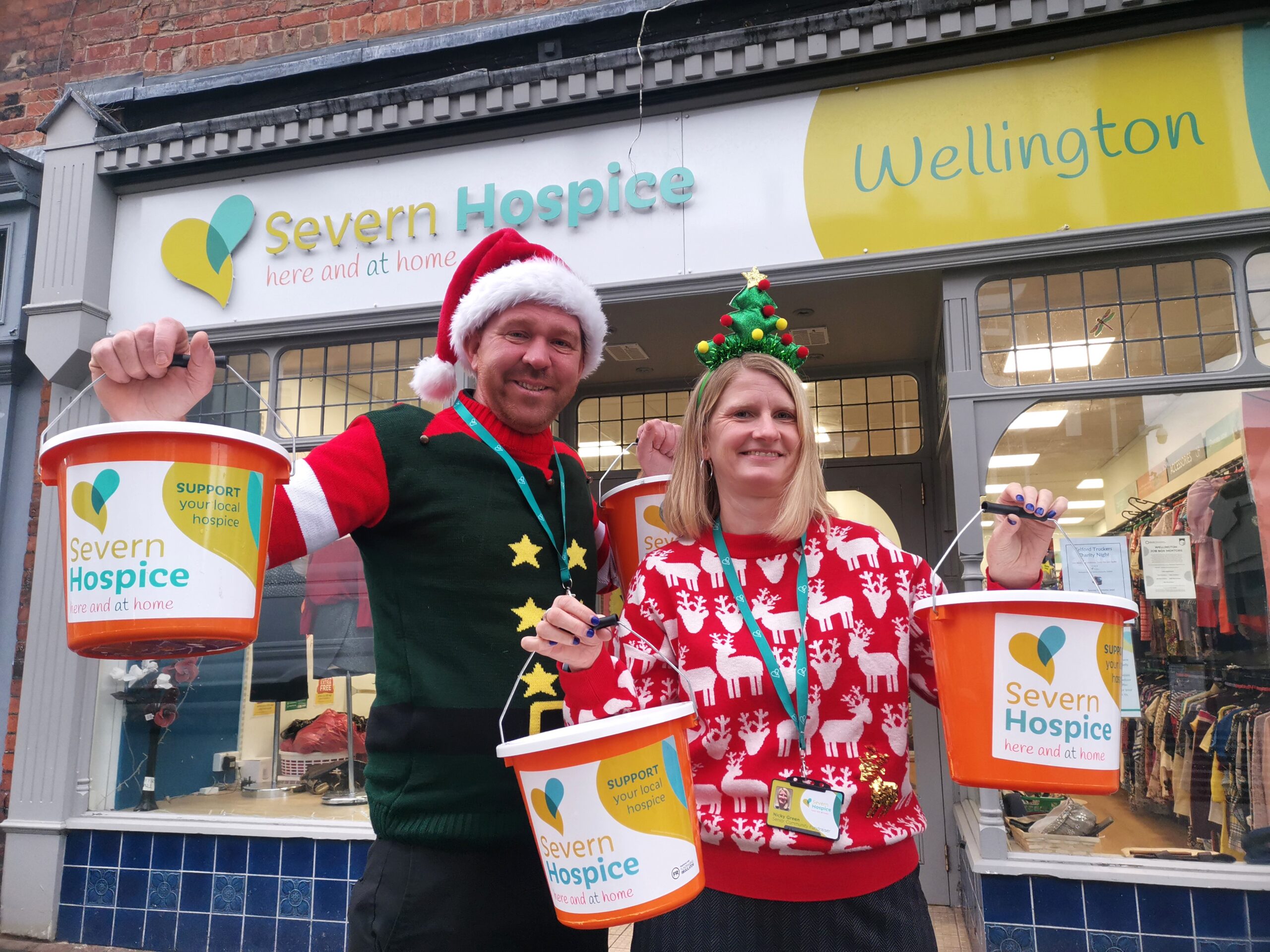 Phil and Nicky, Severn Hospice Community Fundraisers outside the Severn Hospice Wellington shop holding collection buckets